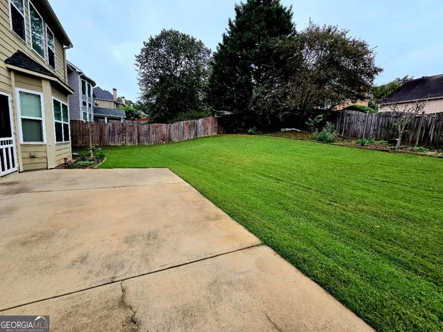 a view of a street with a building in the background