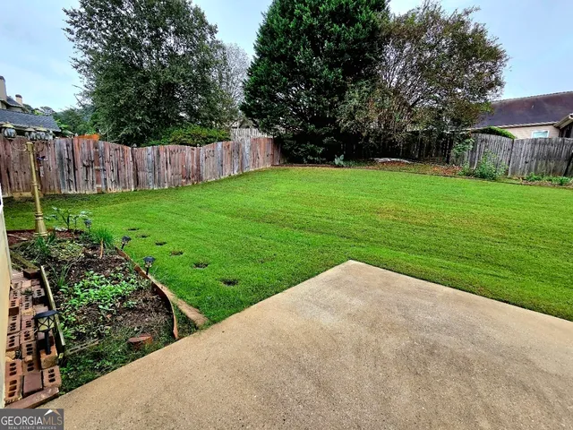 a view of a backyard with a garden