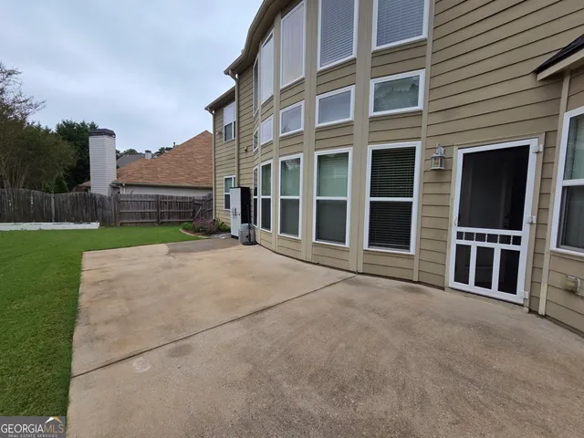 a view of house with yard