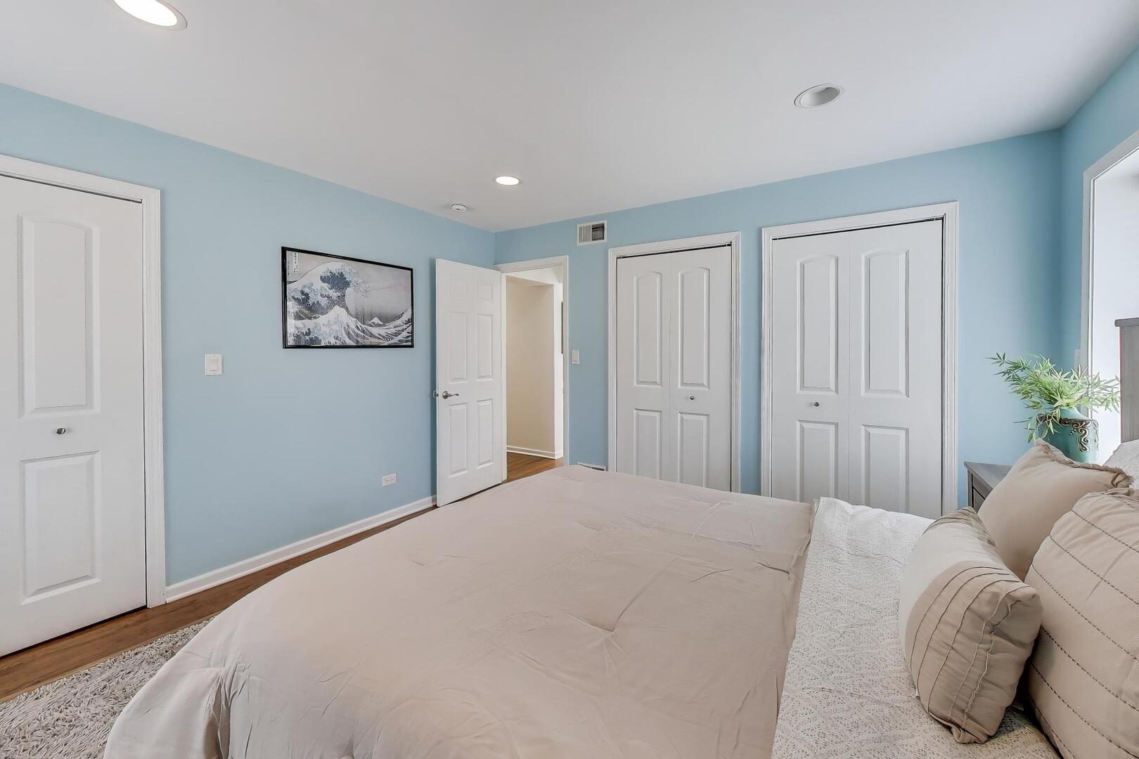 1127 Timber Trails Road Downers Grove, IL 60516 - Photo 14 of 30 a bedroom with a bed and painting on the wall