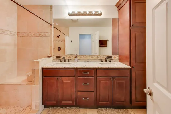 a bathroom with a sink and a mirror