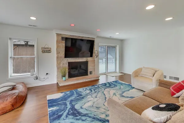 a living room with furniture and a fireplace