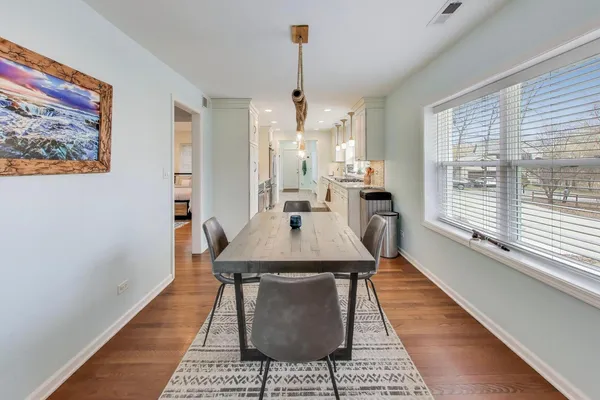 a dining room with furniture and window