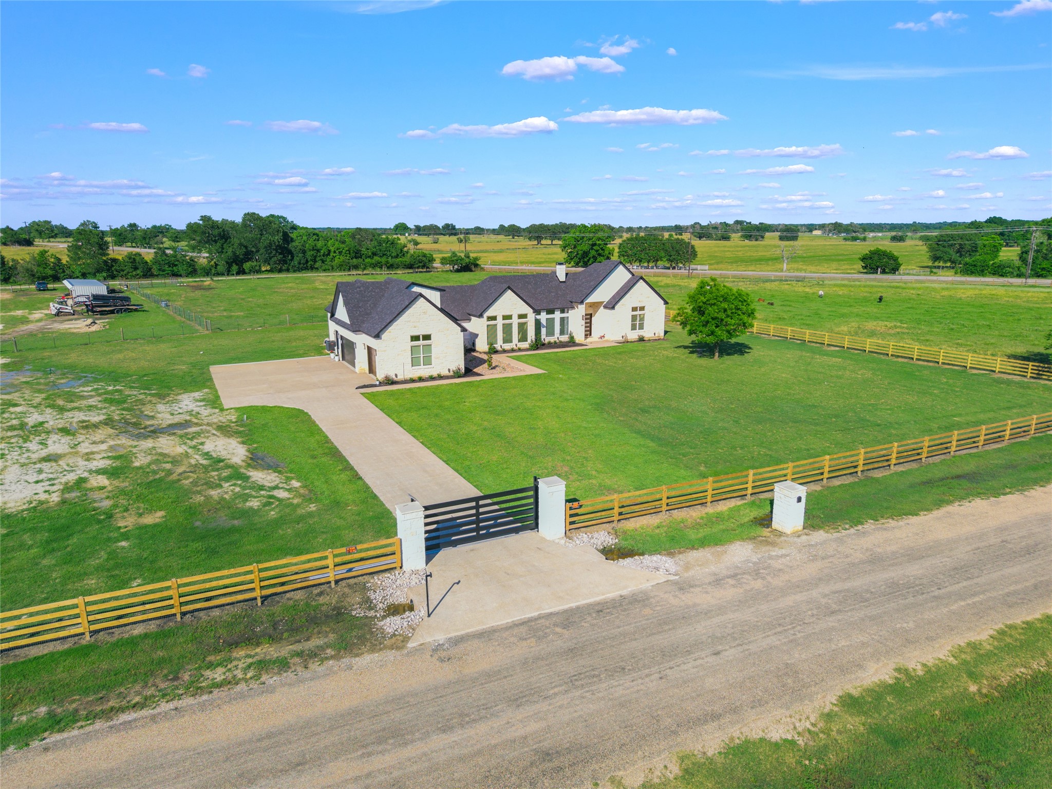 13504 Hudson Farms Road Franklin, TX 77856 - Photo 2 of 49 an aerial view of a house with a garden and big yard