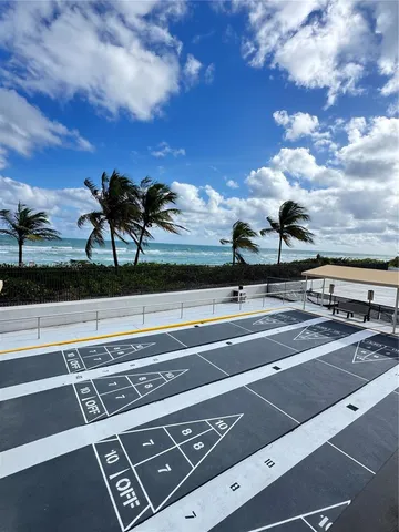 a view of a chairs and table in the patio
