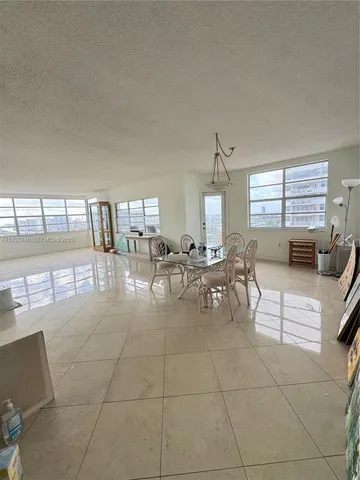 a lobby with furniture and window