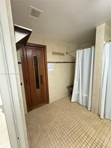 a view of a swimming pool with outdoor seating