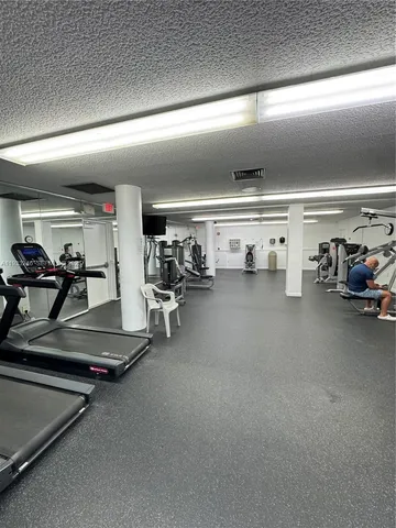 a swimming pool with outdoor seating and yard