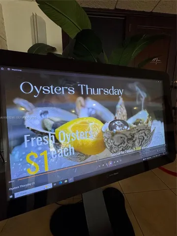 a view of a patio with table and chairs with wooden floor