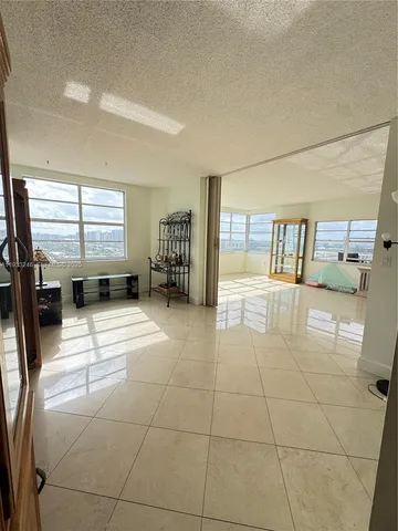 a view of a patio with wooden fence