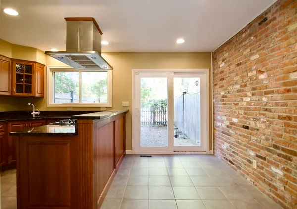 a view of a bathroom with a sink and a mirror