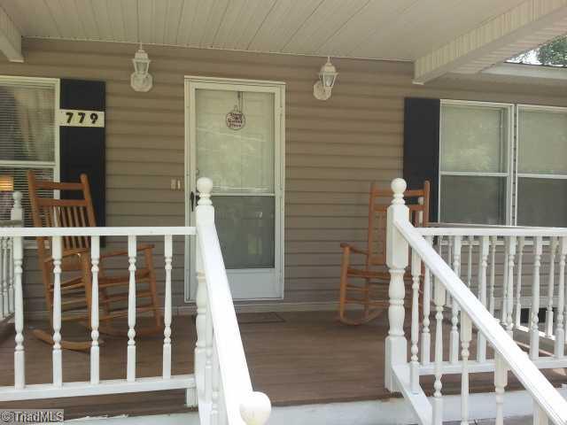 Exterior Front. Rocking chair front porch on private lot.