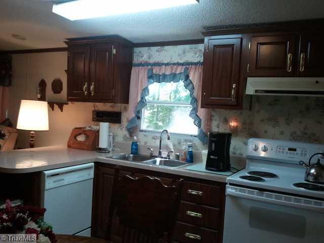 779 Wright Road Lexington, NC 27292 - Photo 8 of 12 Kitchen. Cabinets galore.