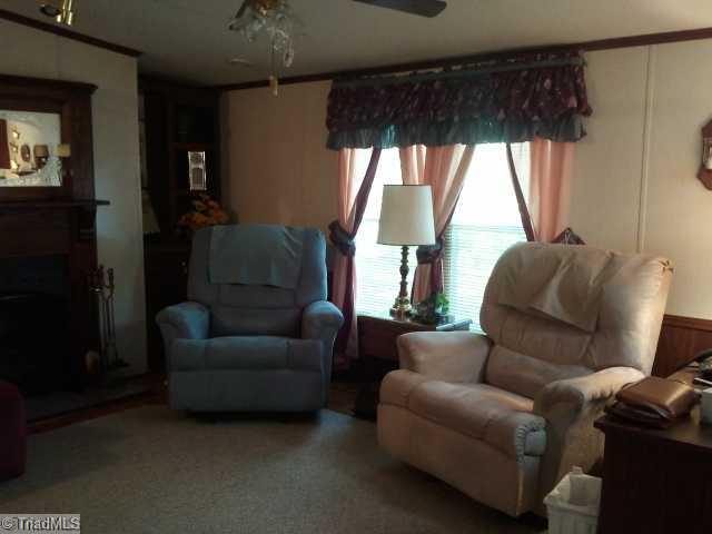 779 Wright Road Lexington, NC 27292 - Photo 9 of 12 Den/Family/Great Room. Cozy den with laminate flooring.