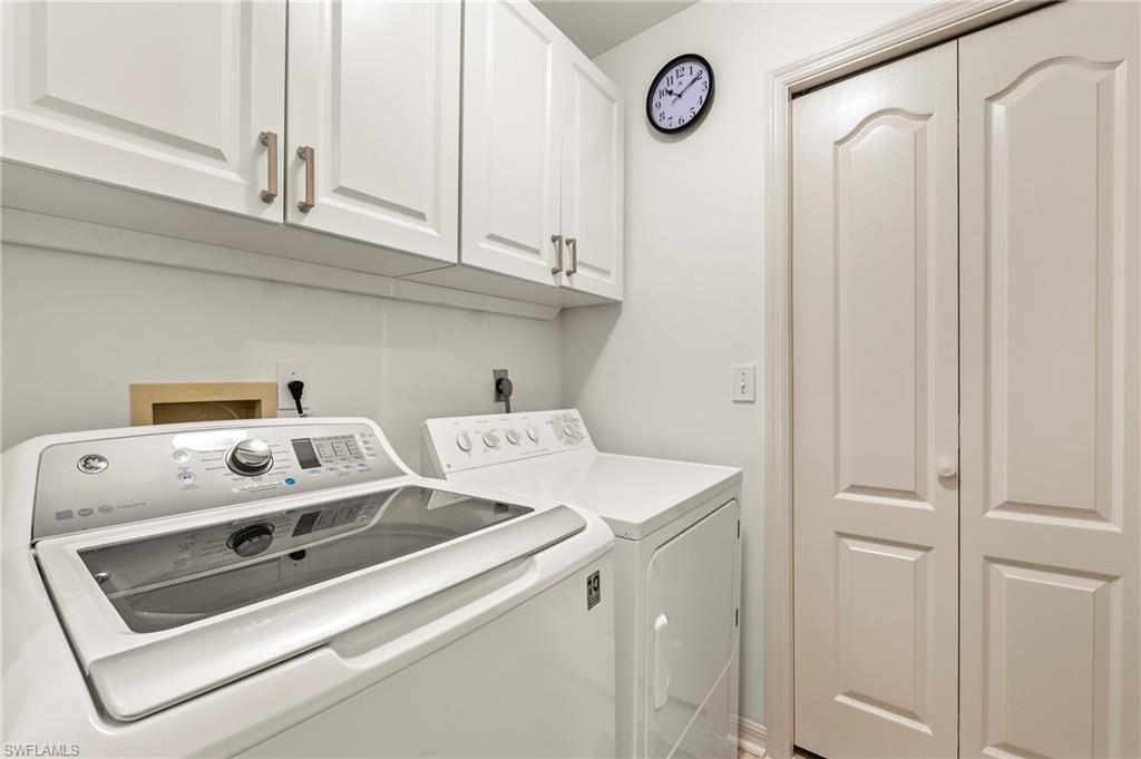 26450 Sunderland Drive, Unit 2102 Bonita Springs, FL 34135 - Photo 14 of 42 a utility room with dryer and washer
