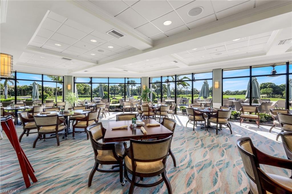 26450 Sunderland Drive, Unit 2102 Bonita Springs, FL 34135 - Photo 23 of 42 a very nice looking living room with furniture and a large window