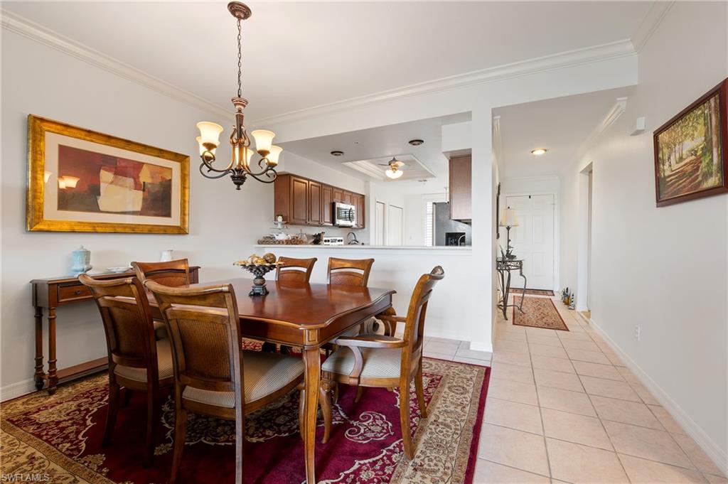 26450 Sunderland Drive, Unit 2102 Bonita Springs, FL 34135 - Photo 6 of 42 a view of a dining room with furniture