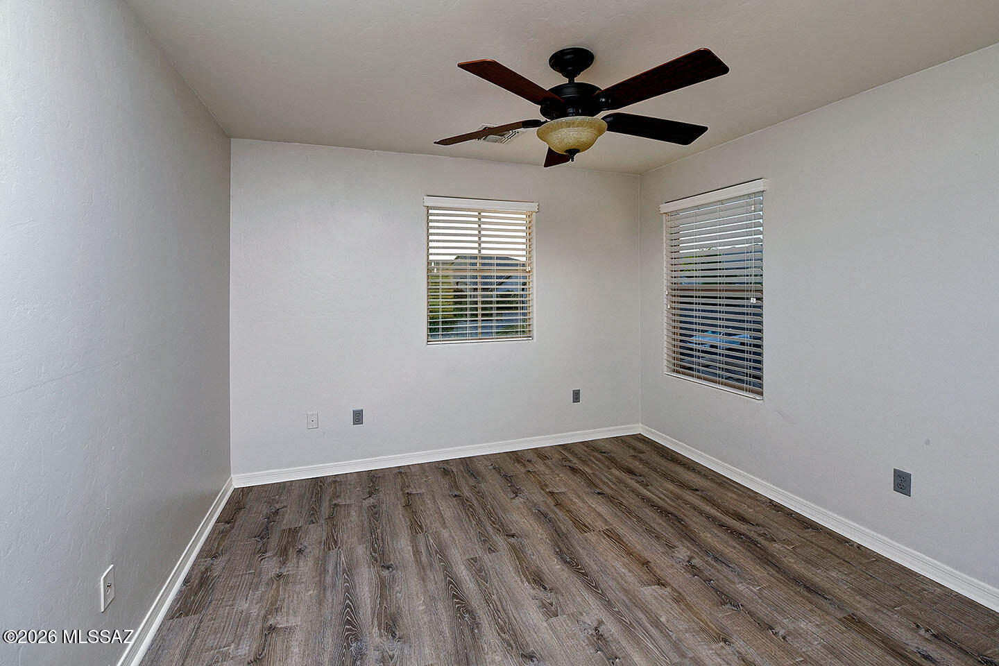 13464 North Piemonte Way Oro Valley, AZ 85755 - Photo 26 of 33 a view of empty room with wooden floor and fan