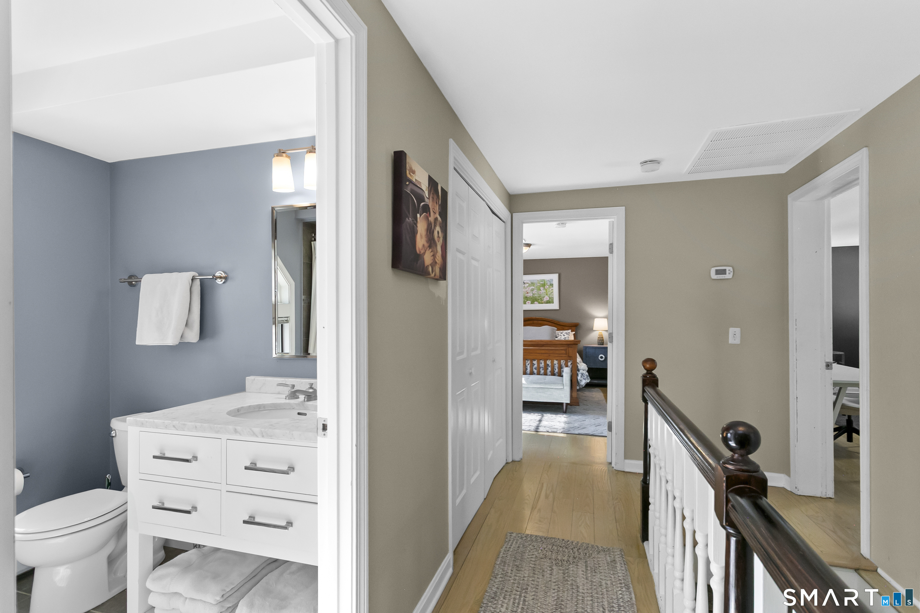 205 Weston Road Weston, CT 06883 - Photo 11 of 21 a en suite bathroom with a toilet a sink and mirror