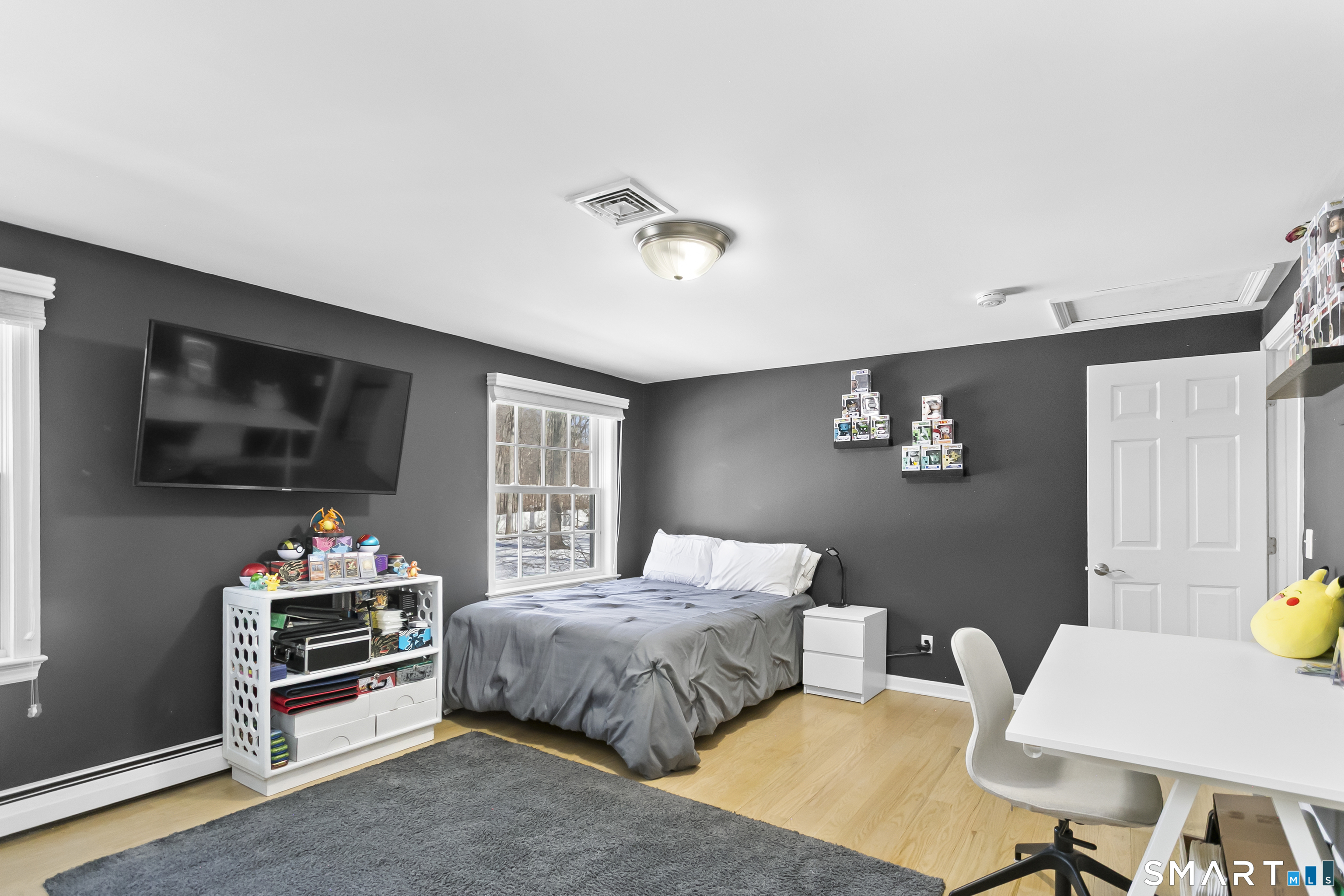 205 Weston Road Weston, CT 06883 - Photo 15 of 21 a bedroom with a bed and a flat screen tv