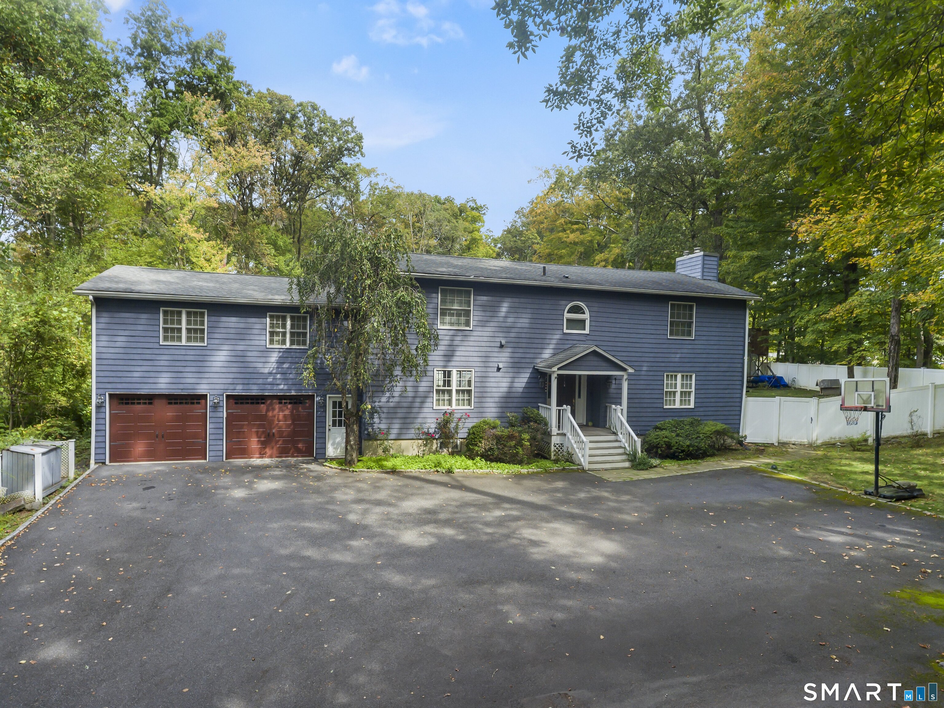 205 Weston Road Weston, CT 06883 - Photo 21 of 21 a front view of a house with garden