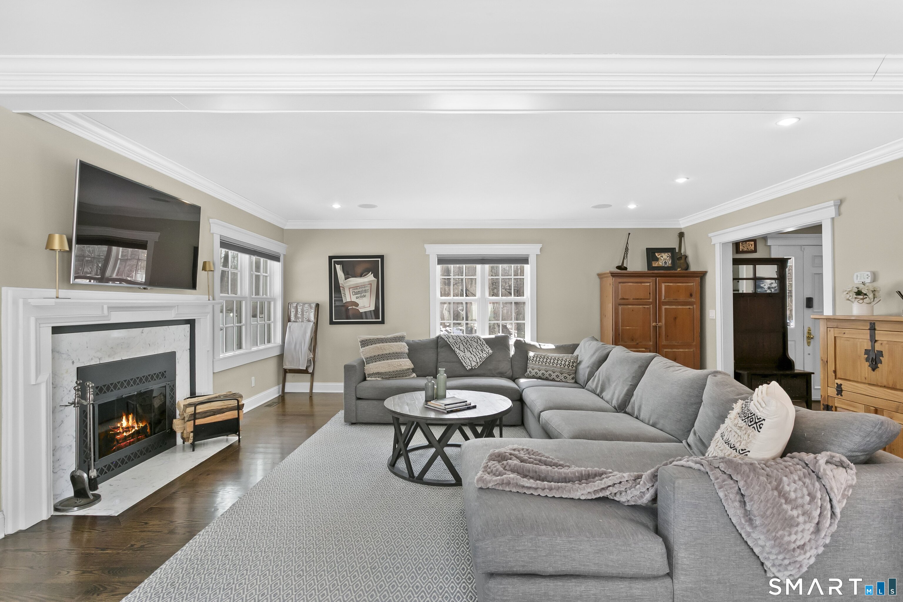 205 Weston Road Weston, CT 06883 - Photo 4 of 21 a living room with furniture a fireplace and a flat screen tv