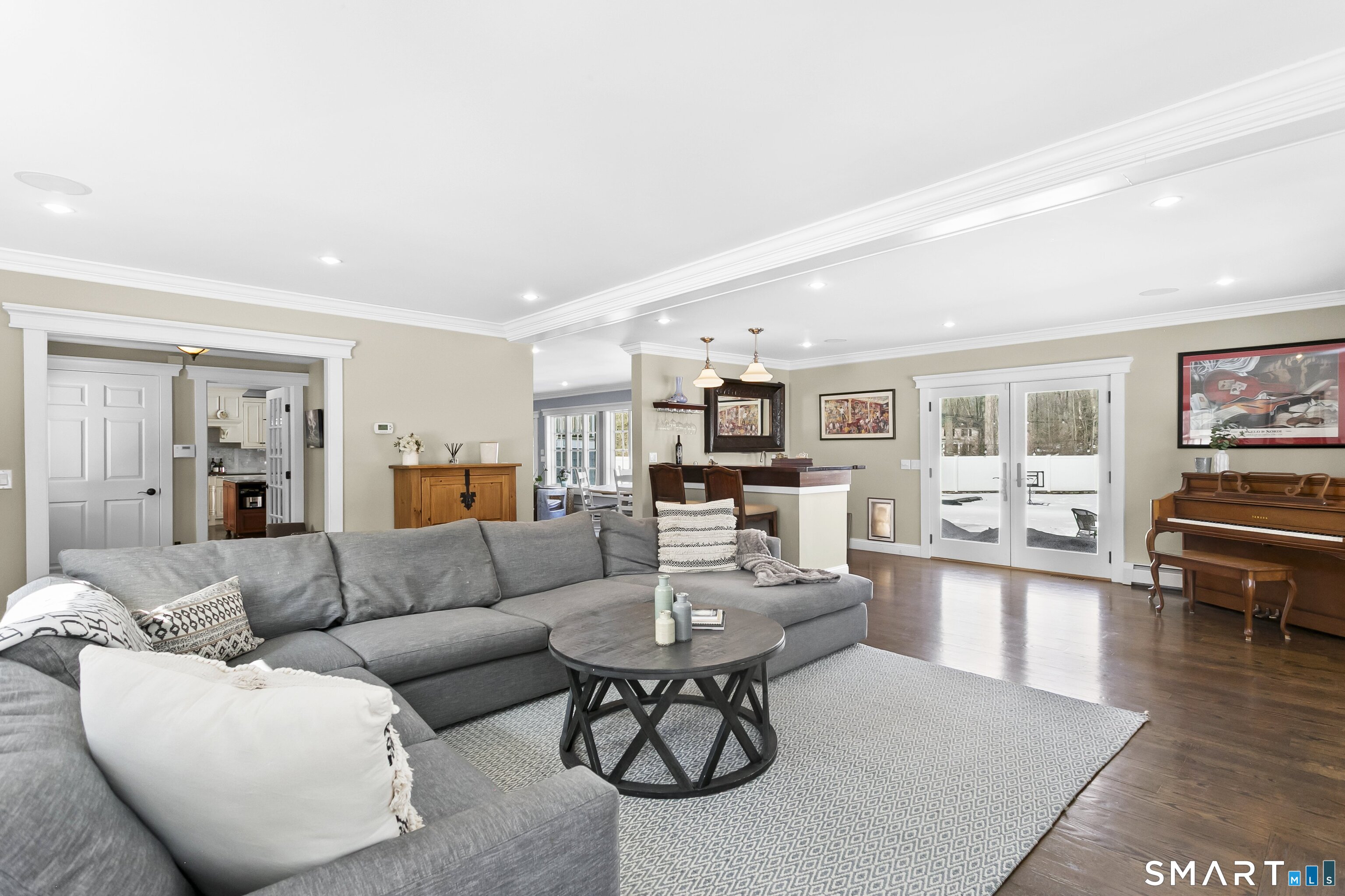 205 Weston Road Weston, CT 06883 - Photo 5 of 21 a living room with furniture a rug and a bookshelf