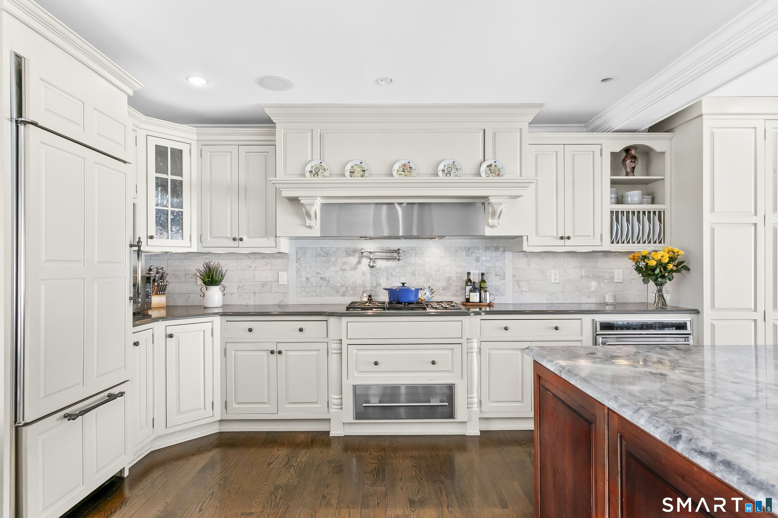 205 Weston Road Weston, CT 06883 - Photo 8 of 21 a kitchen with granite countertop white cabinets and white appliances