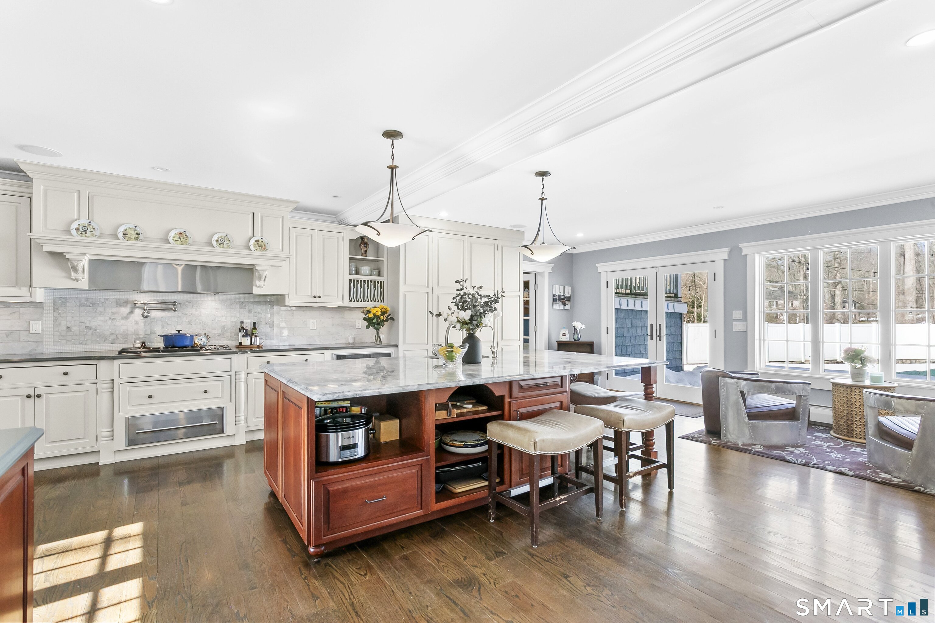 205 Weston Road Weston, CT 06883 - Photo 9 of 21 a large kitchen with stainless steel appliances granite countertop a table chairs stove and kitchen view