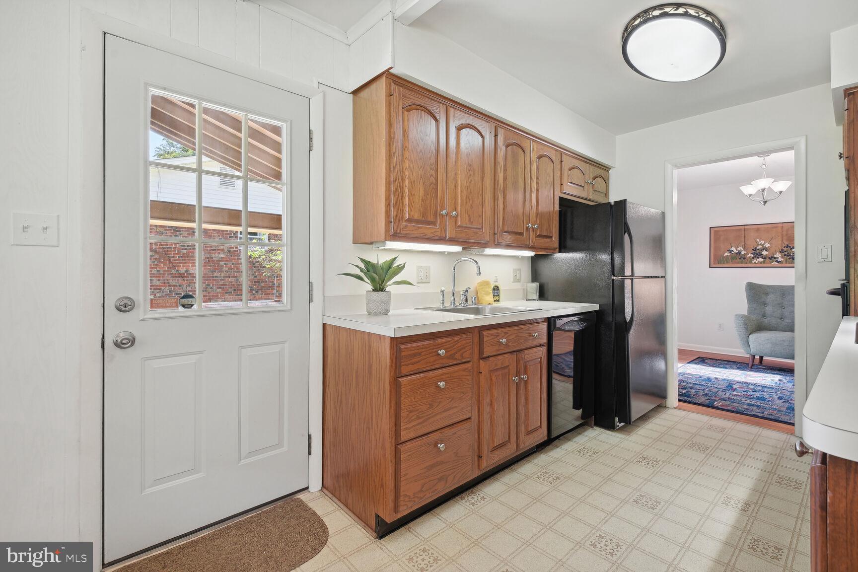 5210 Russett Road Rockville, MD 20853 - Photo 11 of 28 a kitchen with stainless steel appliances granite countertop a stove a sink and a refrigerator