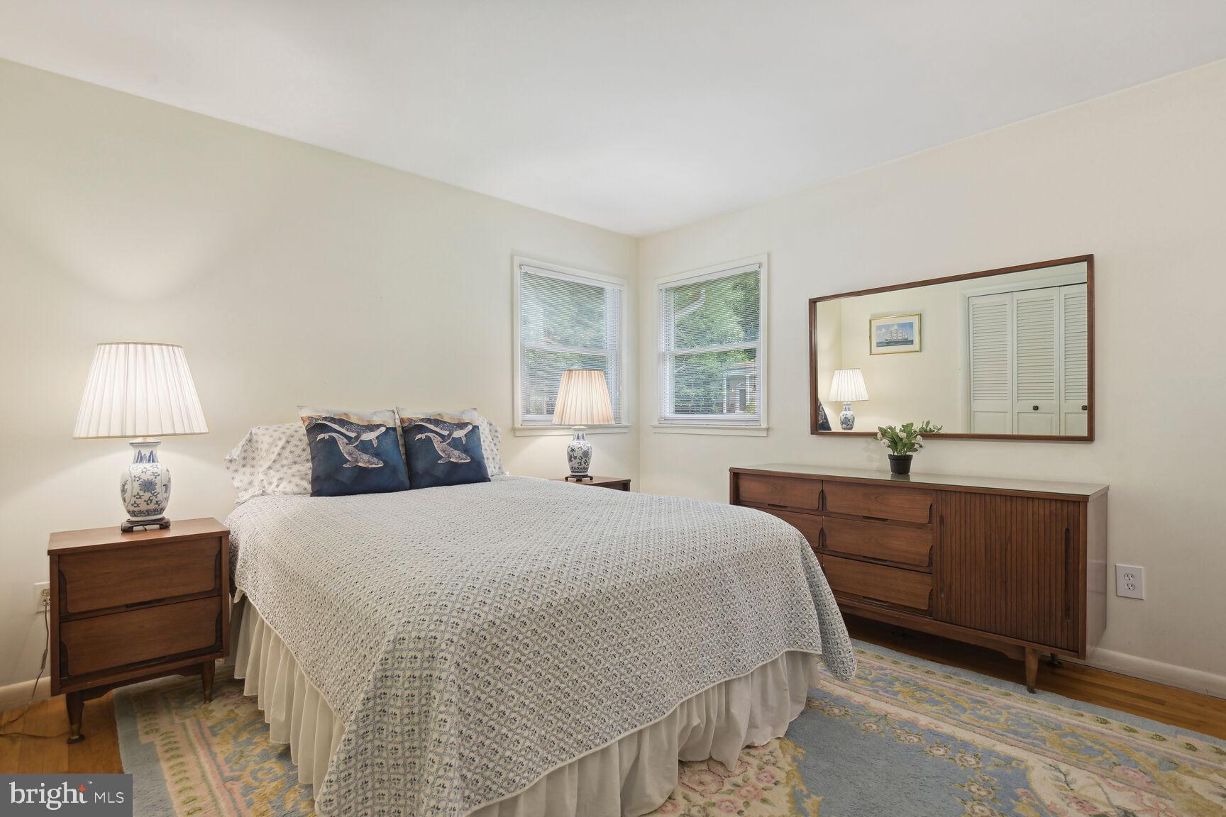 5210 Russett Road Rockville, MD 20853 - Photo 14 of 28 a bedroom with a bed and a dresser
