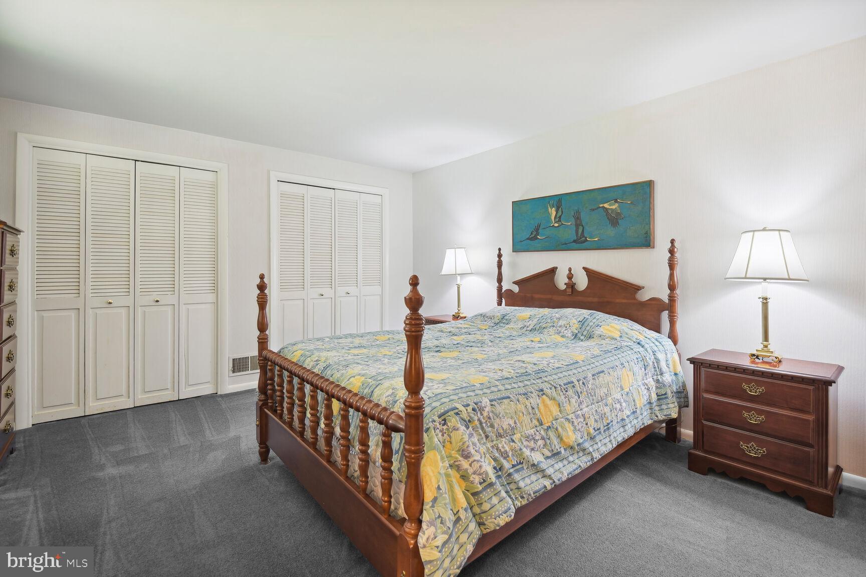 5210 Russett Road Rockville, MD 20853 - Photo 15 of 28 a bedroom with a bed and a night stand