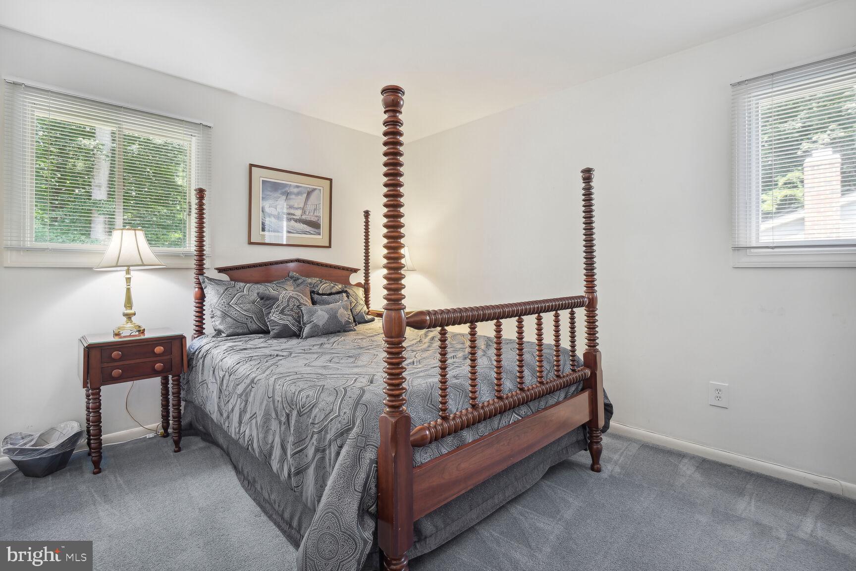 5210 Russett Road Rockville, MD 20853 - Photo 16 of 28 a spacious bedroom with a bed and a window