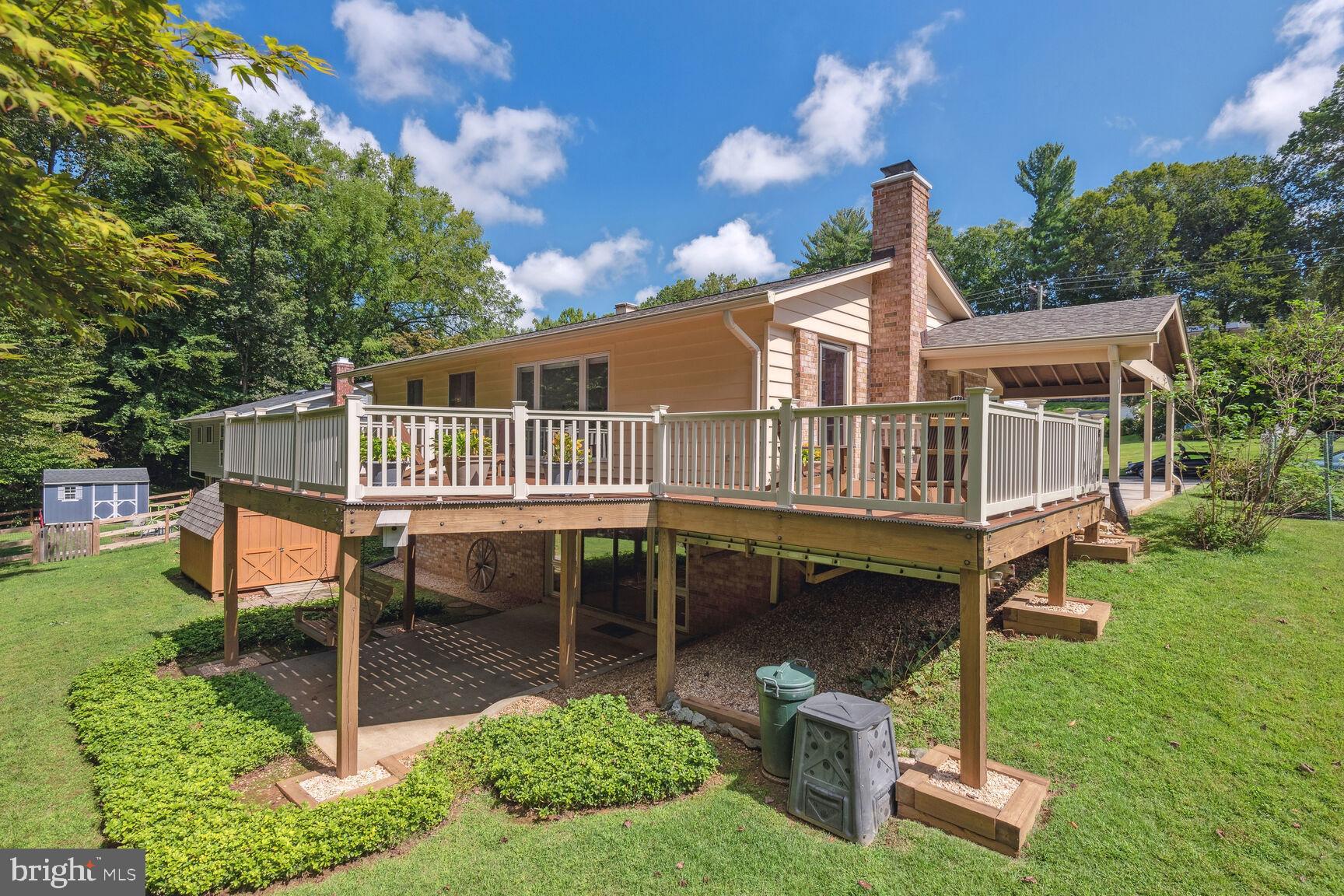 5210 Russett Road Rockville, MD 20853 - Photo 25 of 28 a roof deck with table and chairs a barbeque