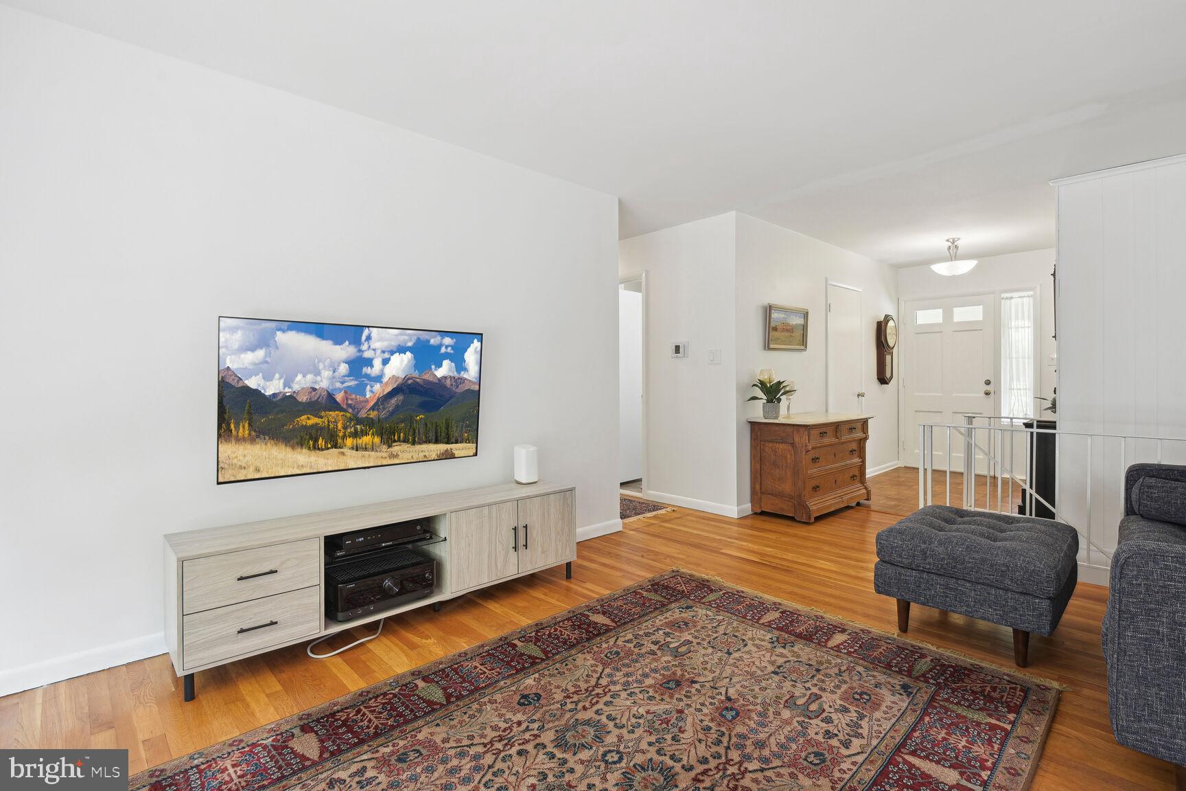 5210 Russett Road Rockville, MD 20853 - Photo 5 of 28 a living room with furniture and a flat screen tv