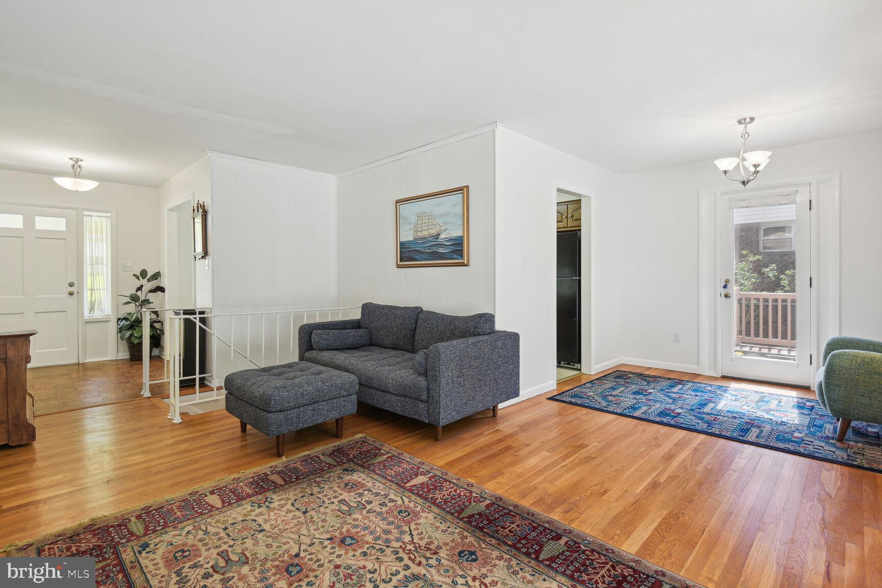 5210 Russett Road Rockville, MD 20853 - Photo 6 of 28 a living room with furniture and a wooden floor
