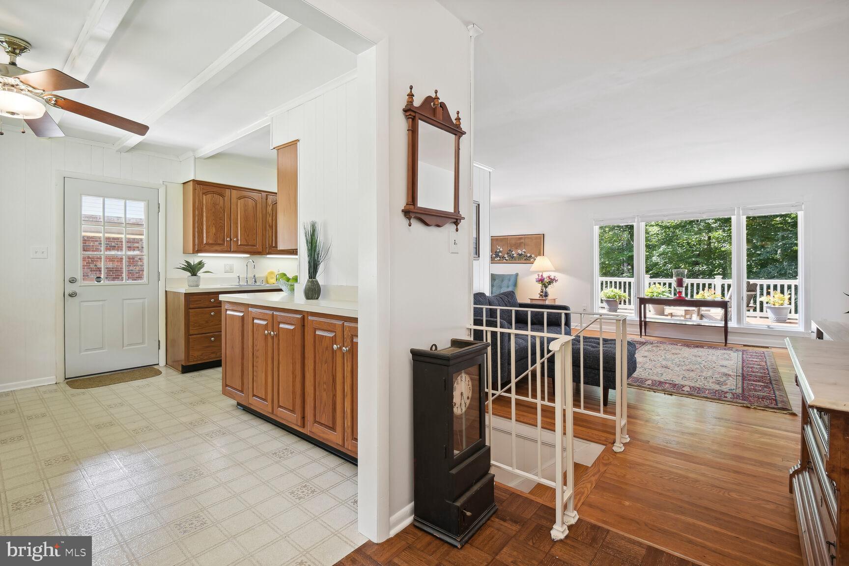 5210 Russett Road Rockville, MD 20853 - Photo 9 of 28 a kitchen with stainless steel appliances a stove top oven a sink a dining table and chairs