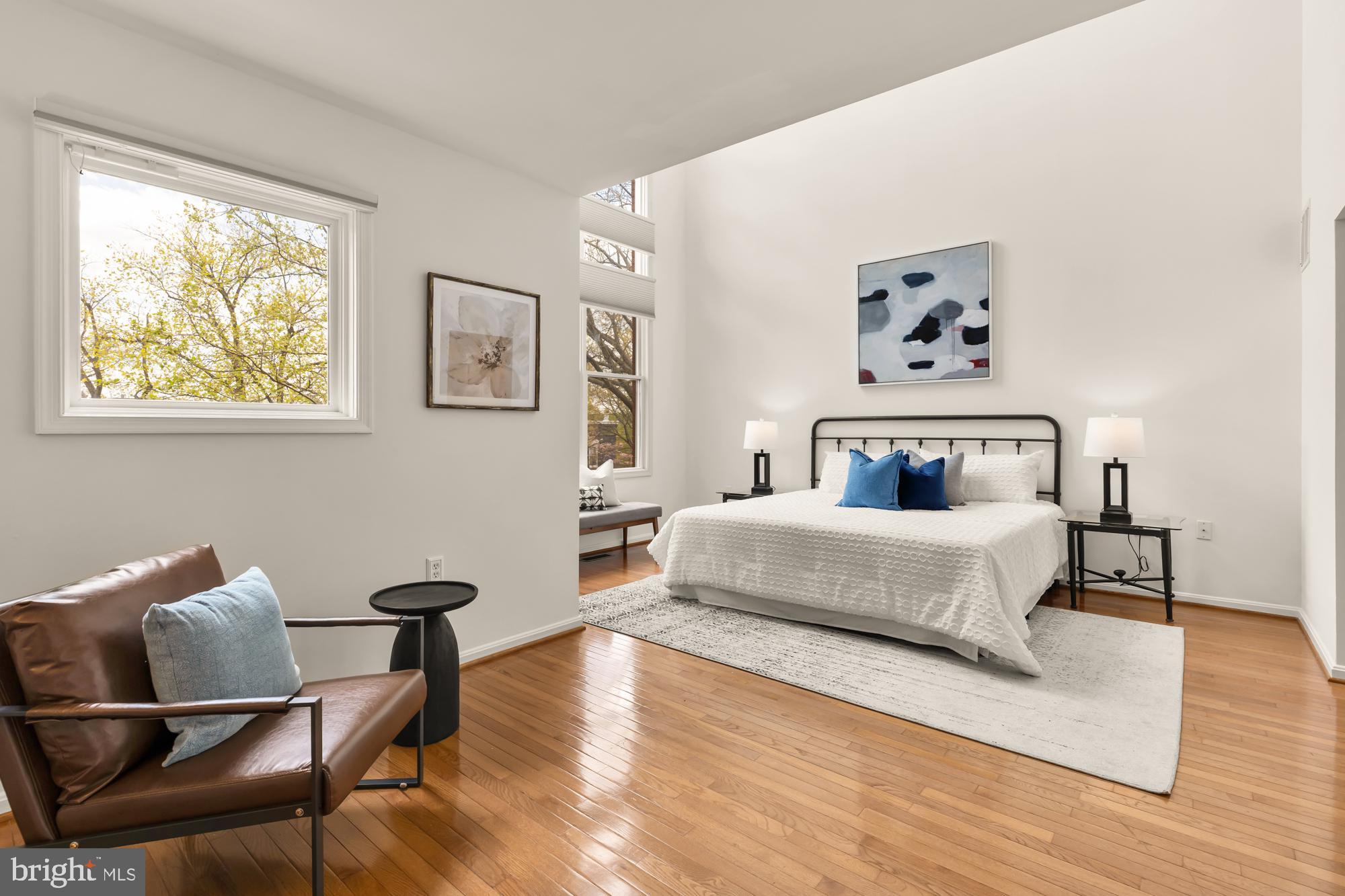 255 14th Street Southeast, Unit A Washington, DC 20003 - Photo 13 of 28 a bedroom with a bed and wooden floor