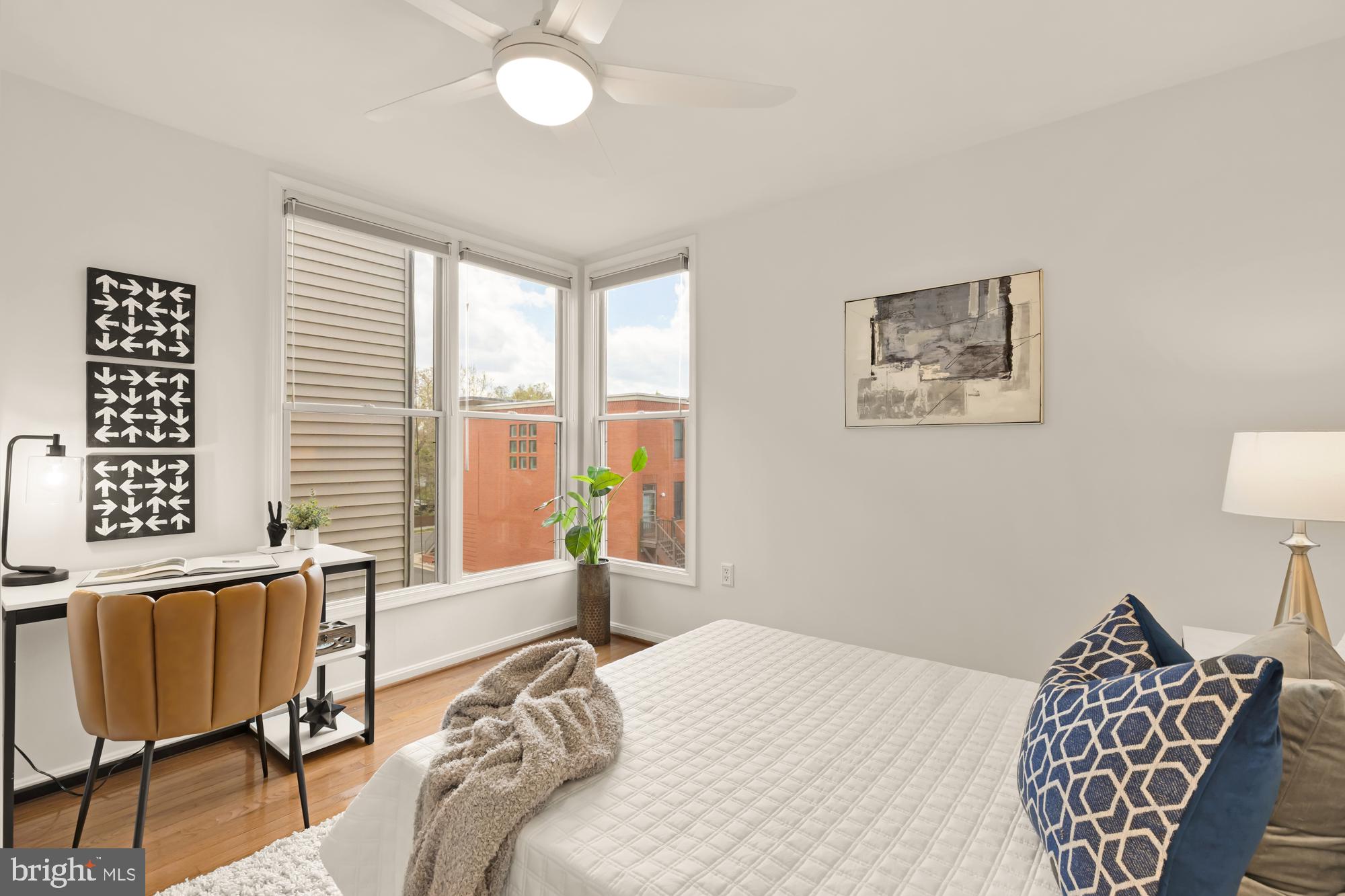255 14th Street Southeast, Unit A Washington, DC 20003 - Photo 24 of 28 a bedroom with a bed and a chandelier
