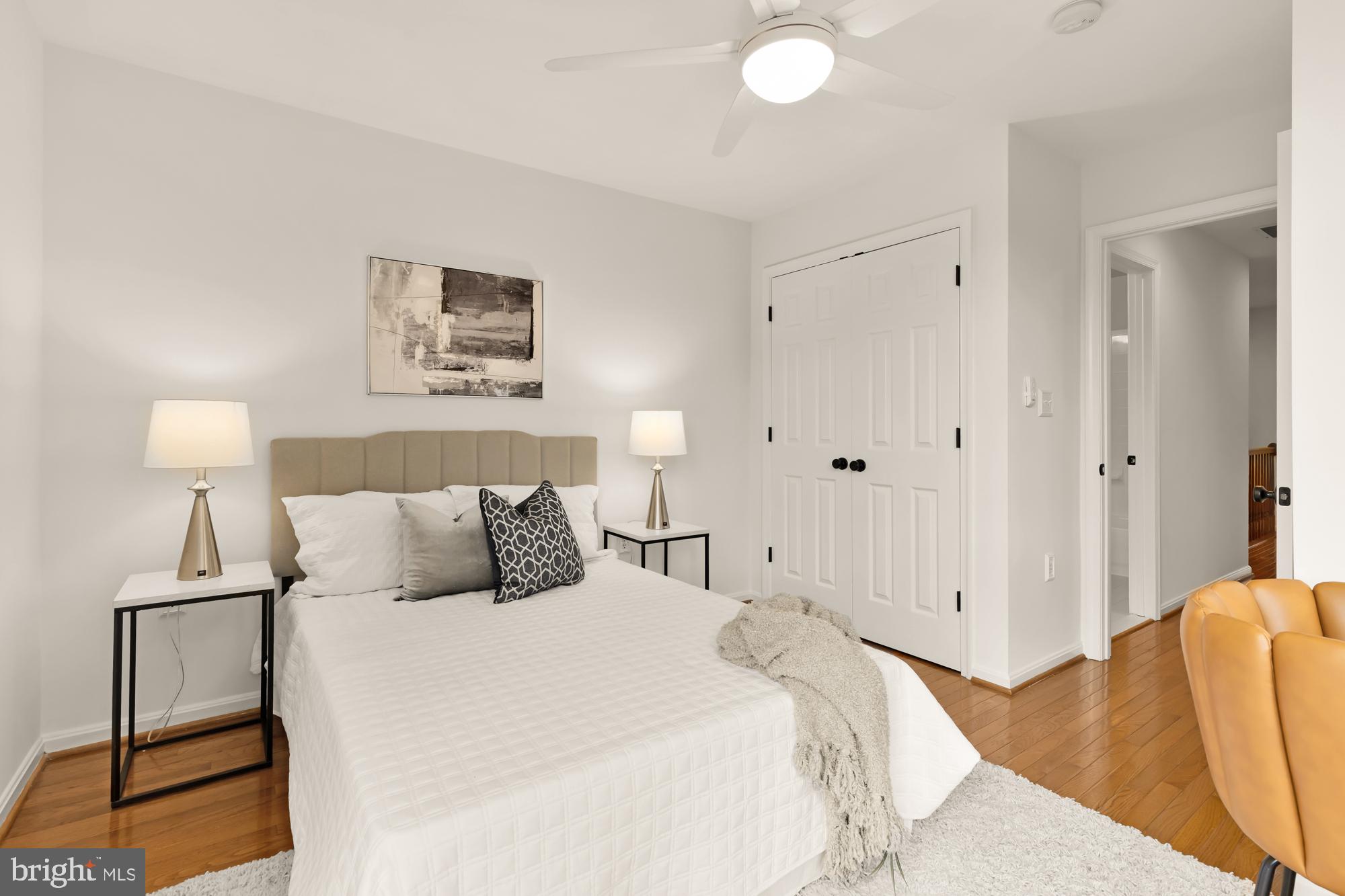 255 14th Street Southeast, Unit A Washington, DC 20003 - Photo 25 of 28 a bedroom with a bed and a lamp