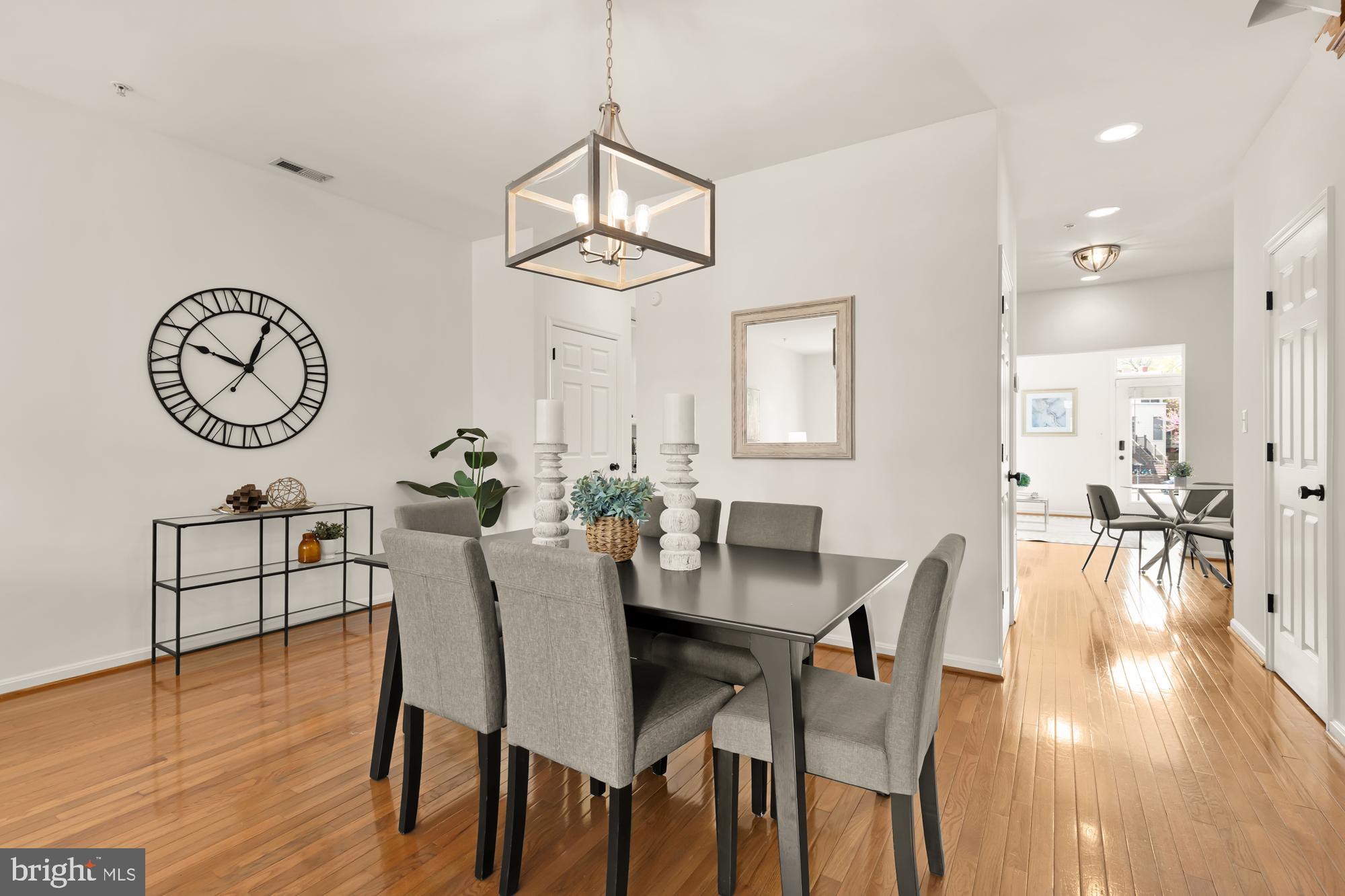 255 14th Street Southeast, Unit A Washington, DC 20003 - Photo 4 of 28 a view of a dining room with furniture a chandelier and wooden floor