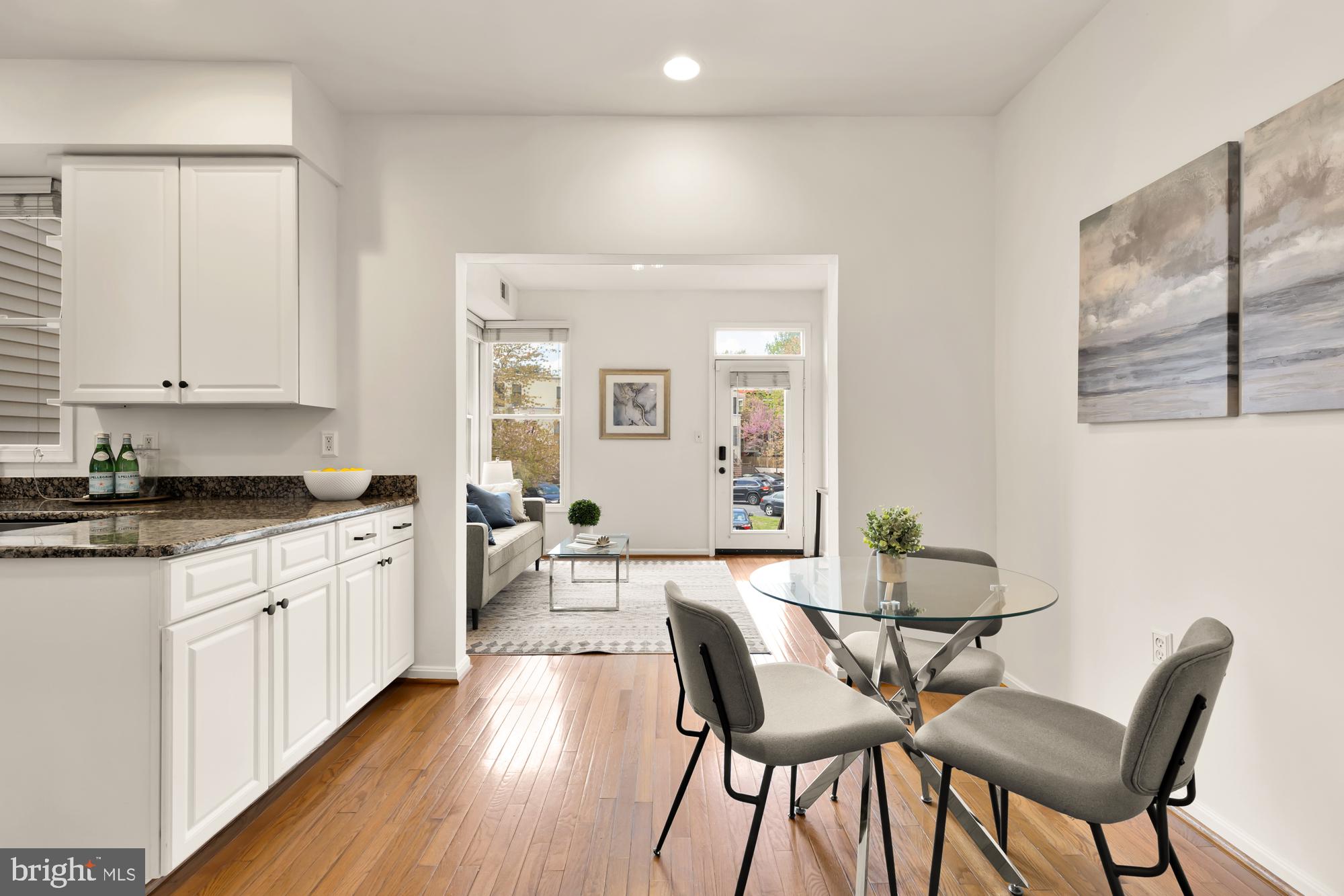 255 14th Street Southeast, Unit A Washington, DC 20003 - Photo 8 of 28 a large kitchen with granite countertop white cabinets and stainless steel appliances