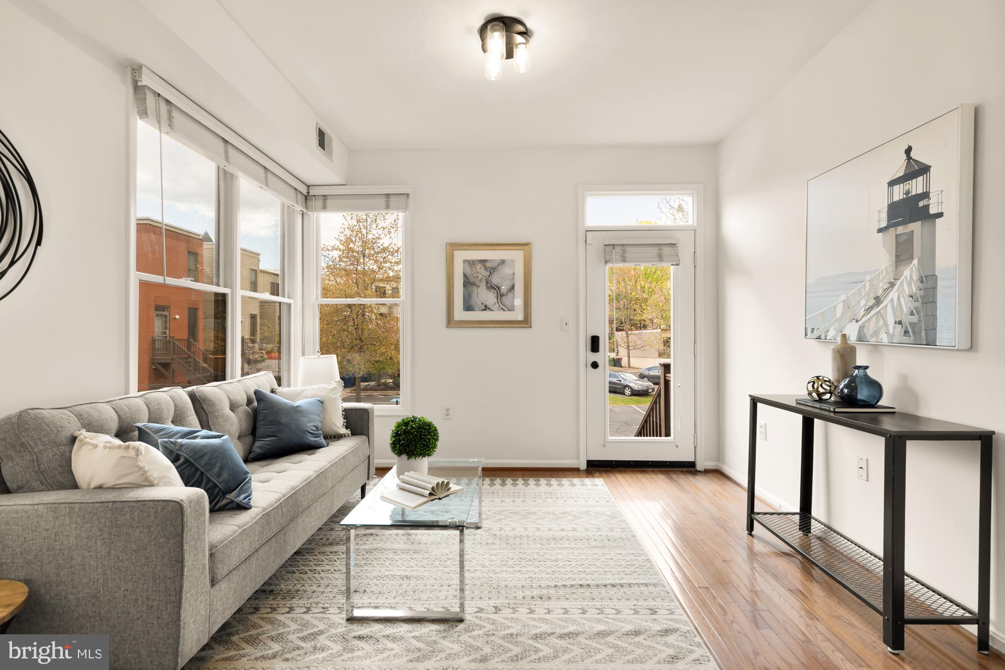 255 14th Street Southeast, Unit A Washington, DC 20003 - Photo 10 of 28 a living room with furniture and a window