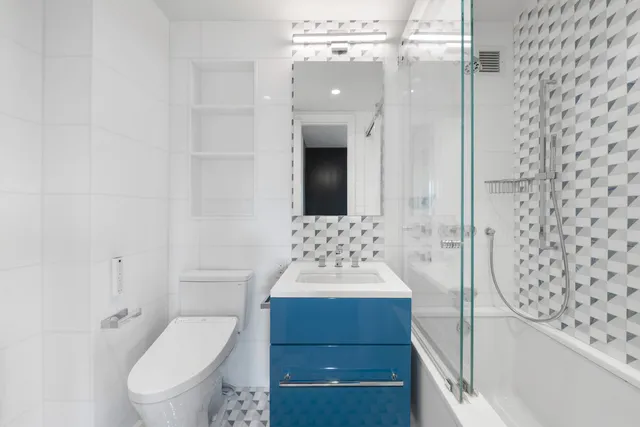 a bed room with a bed window and a television