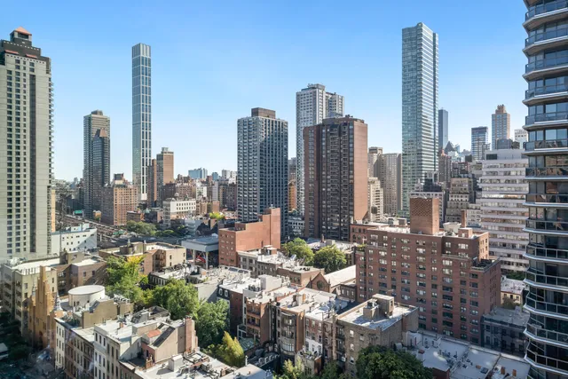 a view of an outdoor space with wooden door and windows