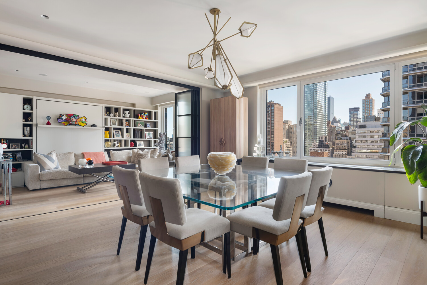 200 East 62nd Street, Unit 19D Manhattan, NY 10065 - Photo 3 of 14 a view of a dining room with furniture window and outside view