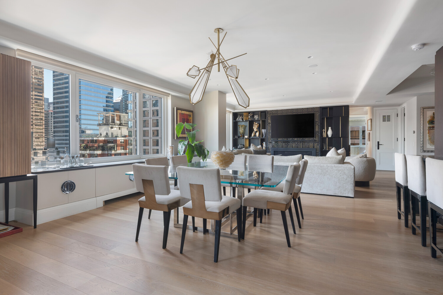 200 East 62nd Street, Unit 19D Manhattan, NY 10065 - Photo 4 of 14 a dining room with furniture window and wooden floor