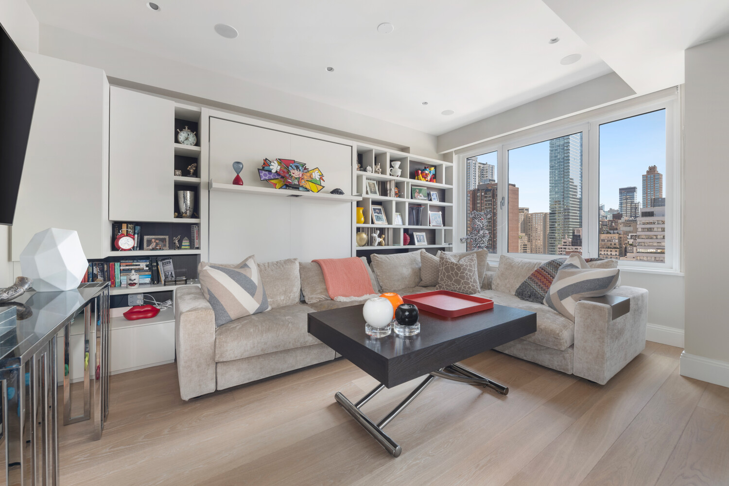 200 East 62nd Street, Unit 19D Manhattan, NY 10065 - Photo 5 of 14 a living room with furniture and a couch