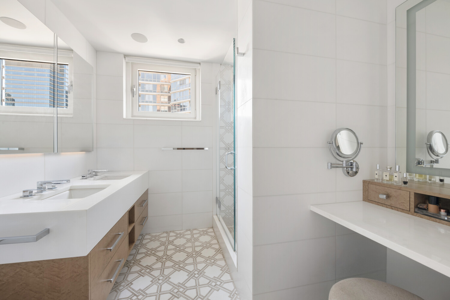 200 East 62nd Street, Unit 19D Manhattan, NY 10065 - Photo 9 of 14 a bathroom with a sink a toilet and mirror