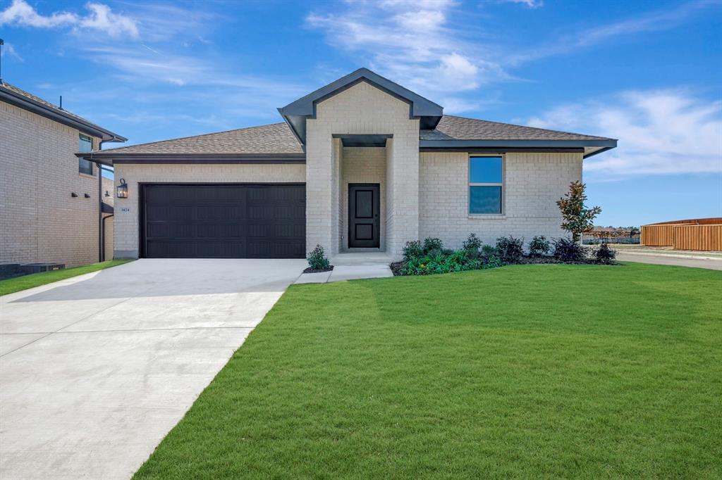 1424 Elliott Road Howe, TX 75459 - Photo 1 of 28 a front view of a house with a garden and yard